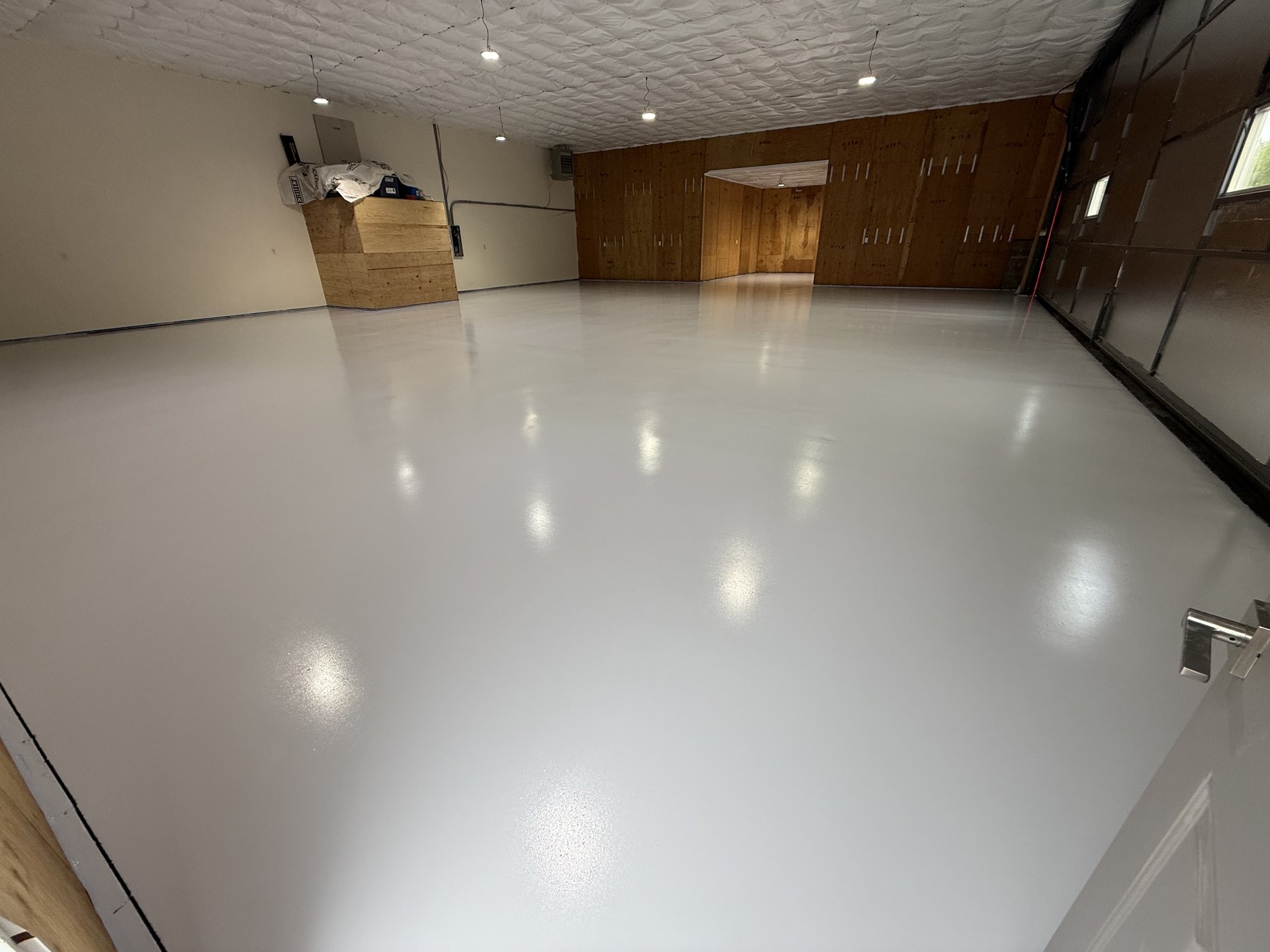 Solid Color Epoxy Hangar Floor Installation in Wasilla Alaska by GlacierShine